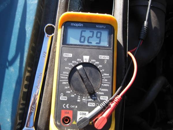 Set engine to a low idle speed